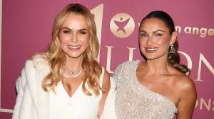 Amanda Holden cuts a chic figure in a white diamond-embellished waistcoat and trousers as she joi…