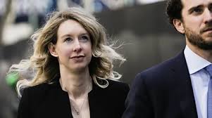 ‘As famous and defiant as ever’: Why Elizabeth Holmes remains the US’s most fascinating fraudster…