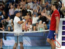 Injured Fritz snaps racquet as US pull off escape | Happy Baez as US star Fritz falls in Perth op…