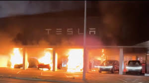 Teslas on fire in shocking Sydney scenes | Three cars destroyed after suspected arson attack at S…
