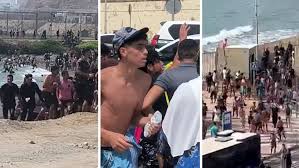 Las imágenes de la llegada masiva de inmigrantes a la frontera de Ceuta con Marruecos: a nado y …