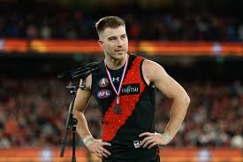 The “ideal world” Merrett AFL trade package for Essendon | Essendon great hopes Zach Merrett isn’…